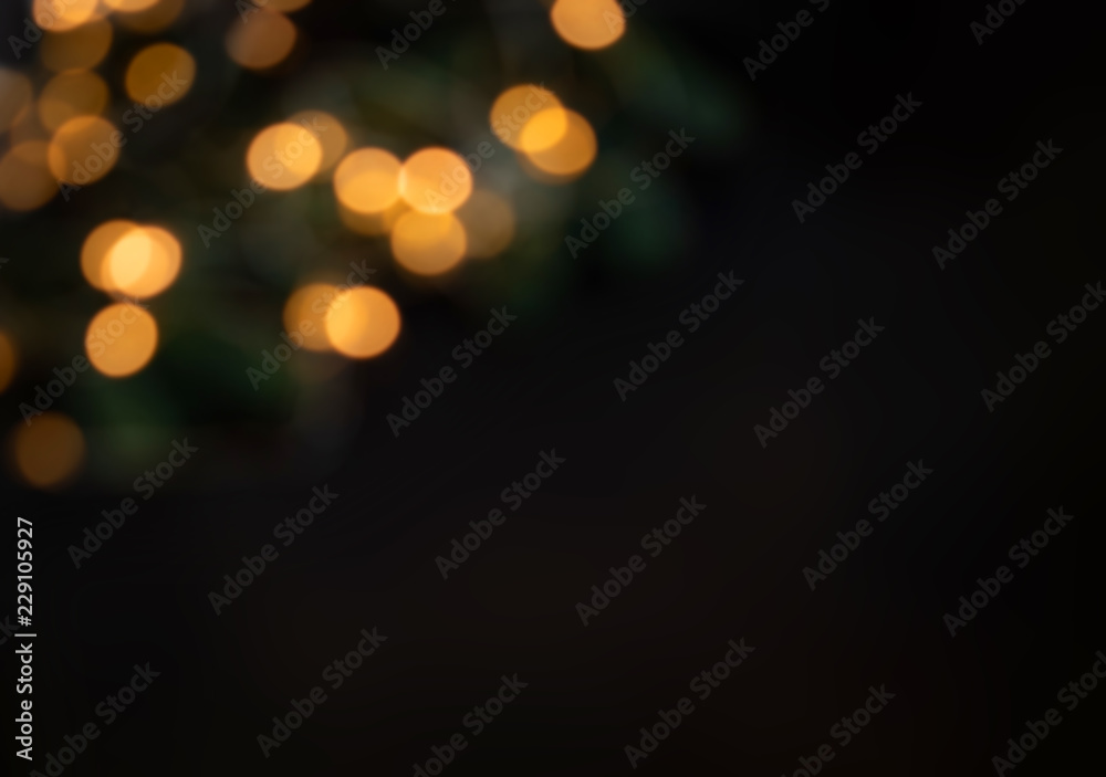  Golden  Christmas bokeh lights on black  Background.  Abstract Yellow  glowing efocused lights, copyspace
