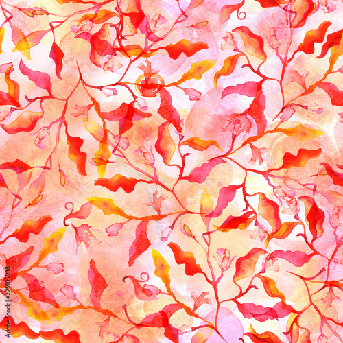 Seamless pattern with abstract red and yellow branches and leaves and a watercolour splashes texture