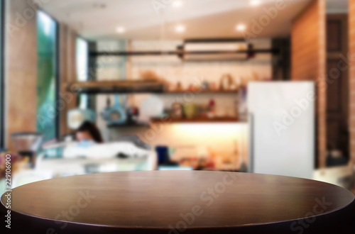 Selected focus empty brown wooden table and Coffee shop or restaurent blur background with bokeh image. for your photomontage or product display.