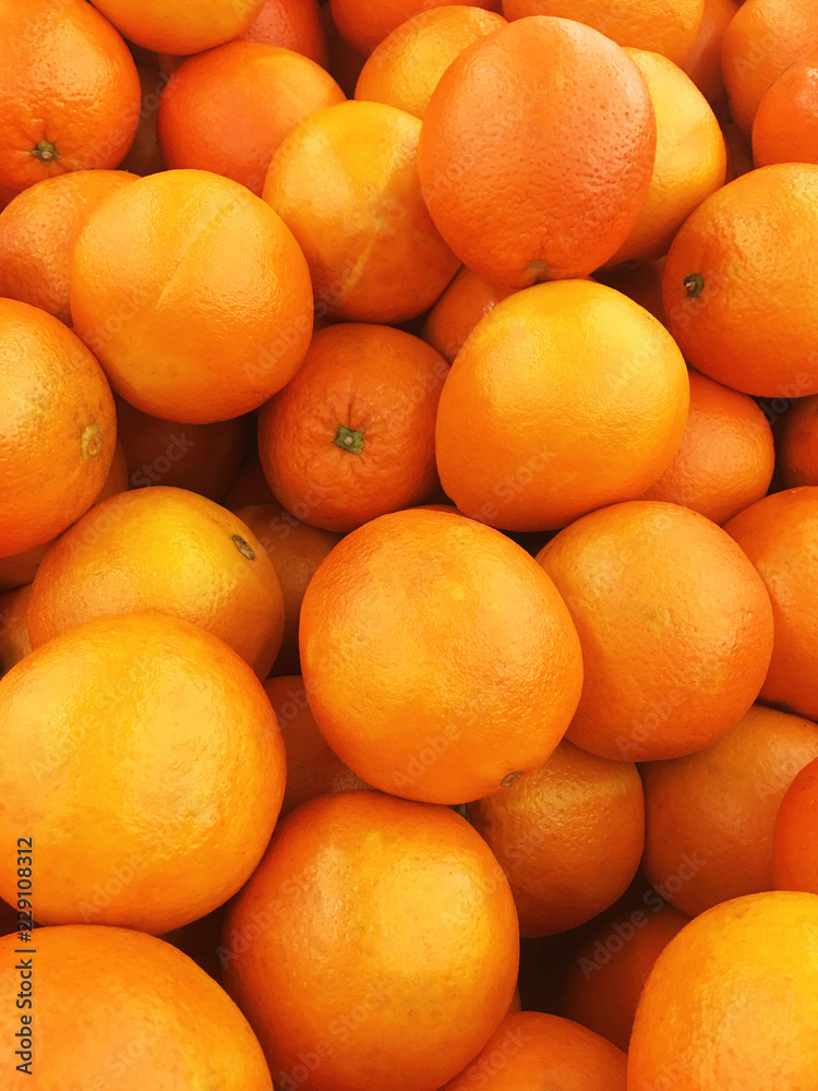 Healthy fruits, orange fruits background many orange fruits - orange fruit background in a supermarket super store