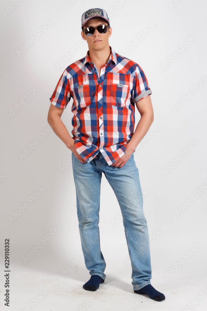 young man in a cap and glasses young man in a cap and glasses