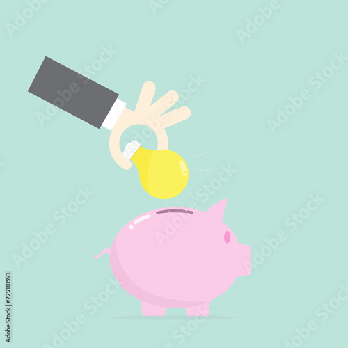Hand put bulb to piggy,idea saving concept
