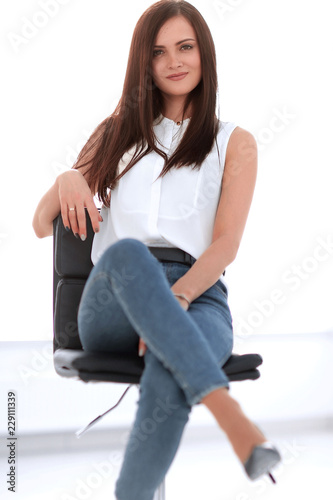 young successful woman sitting in a chair