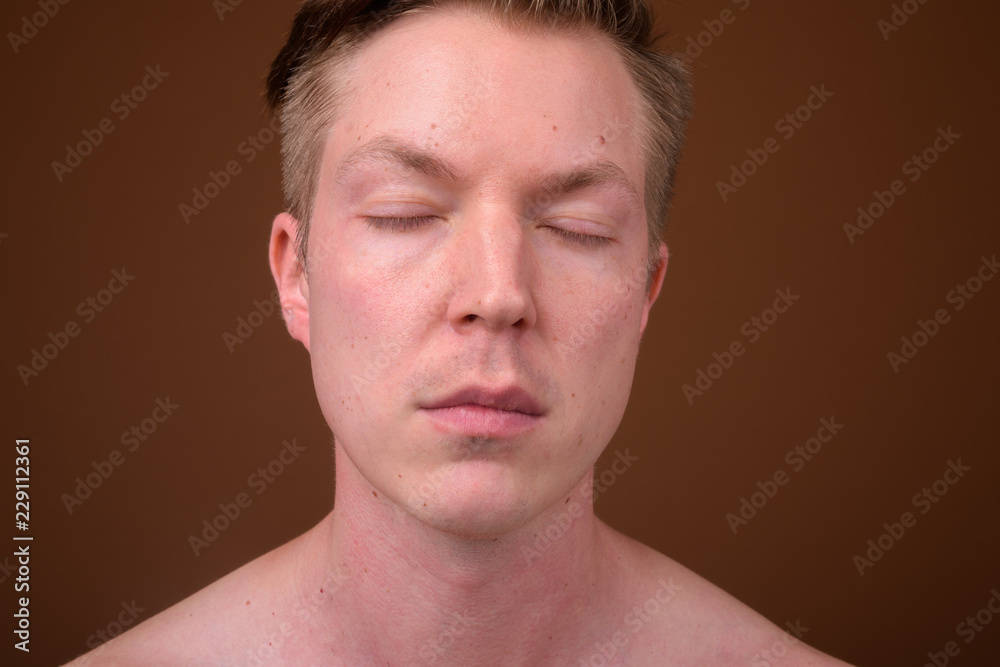 Portrait of young man face relaxing with eyes closed Portrait of young man face relaxing with eyes closed