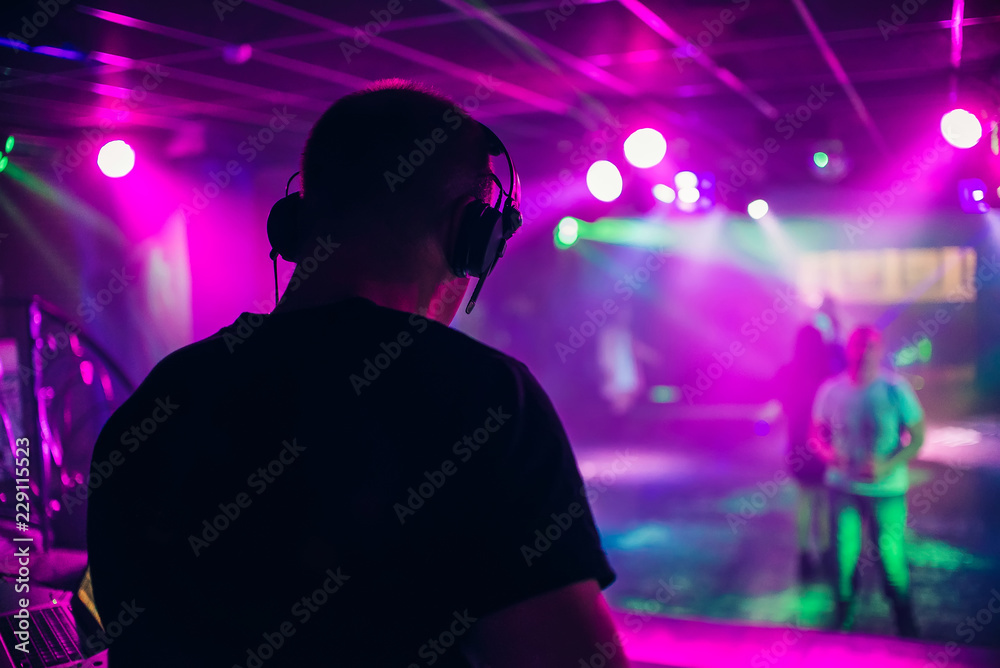 custom made wallpaper toronto digitalDJ mixes music in a nightclub with people dancing on the dance floor