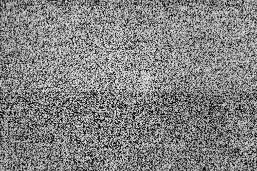 No signal TV texture. Television grainy noise effect as a background. No signal retro vintage television pattern. Interfering signal in analog television. photo