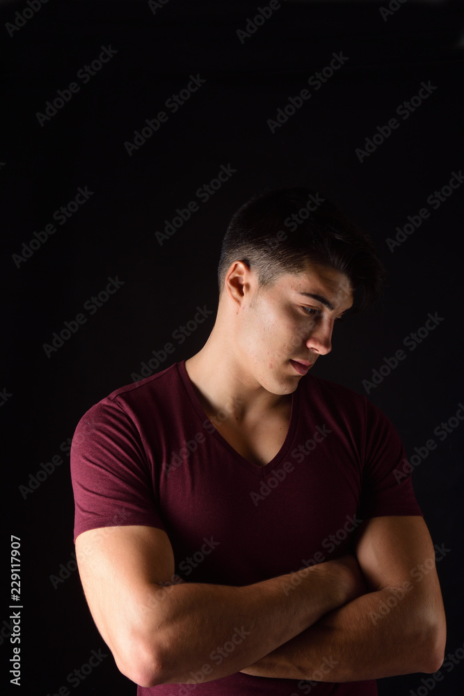  portrait of a young man on black background