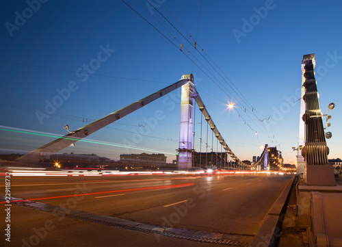 Krymsky Bridge or Crimean Bridge (night) is a steel suspension bridge in Moscow, Russia. The bridge spans the Moskva River 1,800 metres south-west from the Kremlin photo