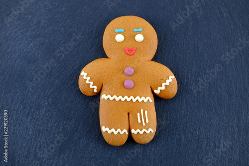 Gingerbread Man on dark background. Christmas or New Year composition.