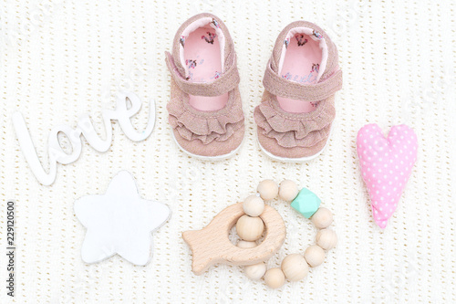 Baby shoes for girls and teether wooden