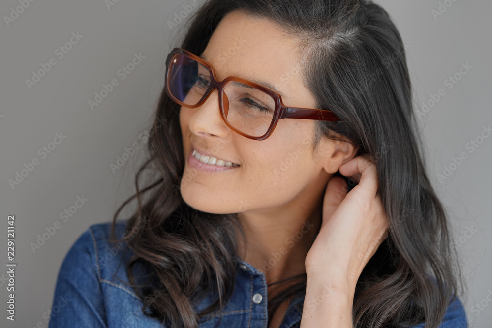 Portrait of attractive brunette woman with eyeglasses, isolated