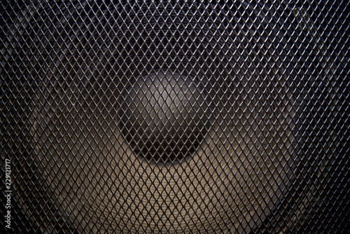 Musical powerful speaker with a protective grill close-up.