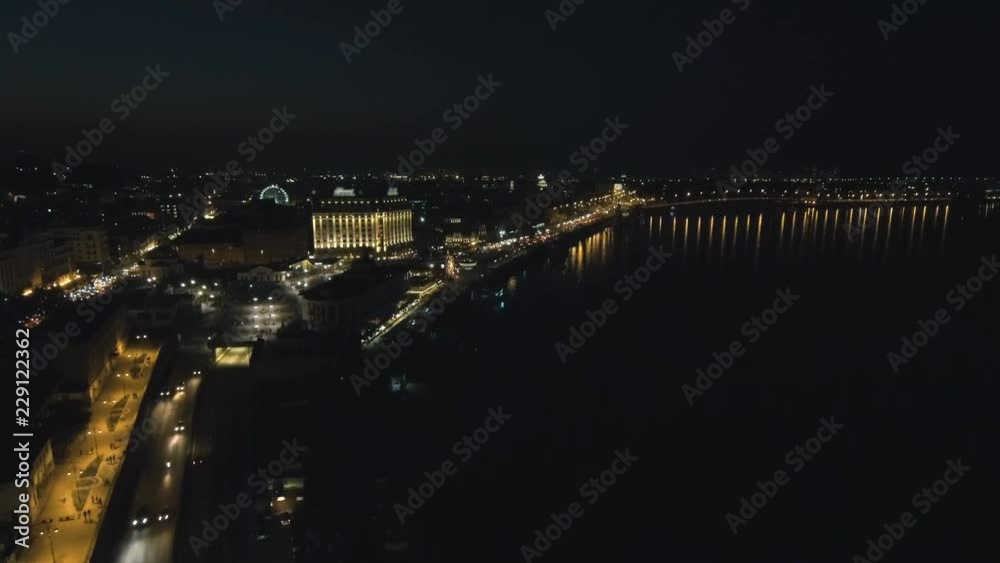 Aerial view from Drone: Top view of the night promenade with bridges and cars. Driving with headlights on the road. Aerial view from Drone: Top view of the night promenade with bridges and cars. Driving with headlights on the road.