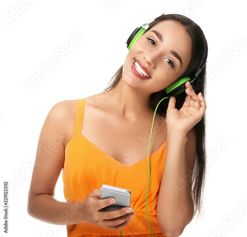 Beautiful young woman liste...