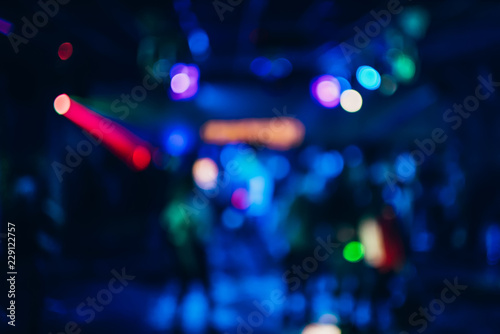 Colorful background with bokeh defocused blurred multicolored lights in a nightclub