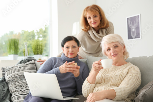 Three mature women relaxing...