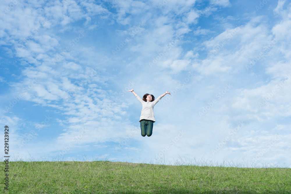 Women are happily jumping on the mountain. Women are happily jumping on the mountain.