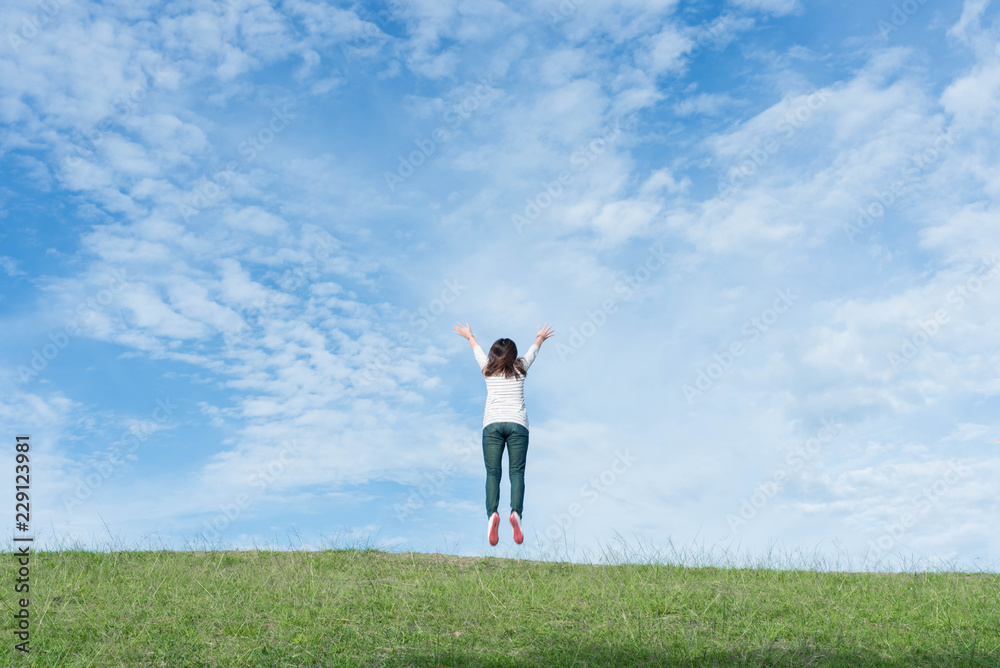 Women are happily jumping on the mountain. Women are happily jumping on the mountain.