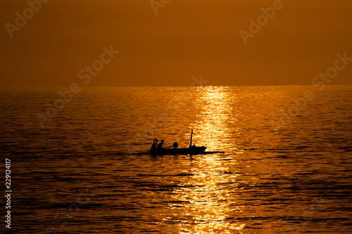 fisher boat during sunset in Lombok Indonesia