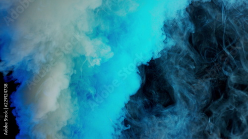 white and blue bomb smoke on black background