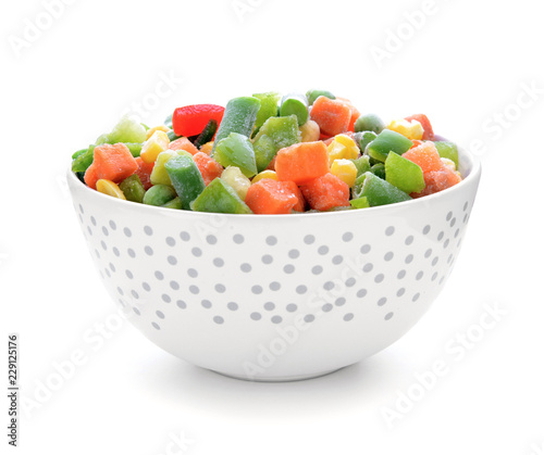 Bowl with frozen vegetables on white background
