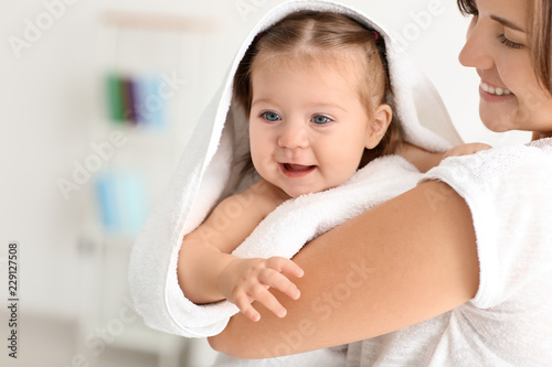 Young mother with cute litt...