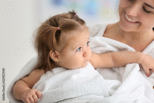 Young mother with cute litt...