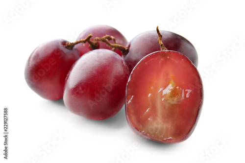 Ripe grapes on white background