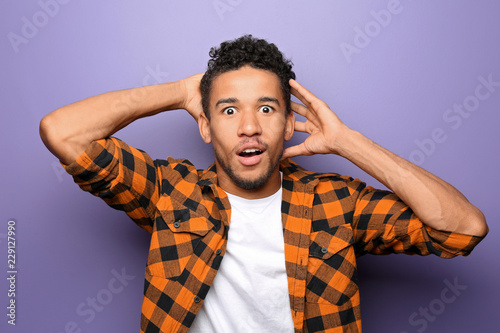 Portrait of shocked African...