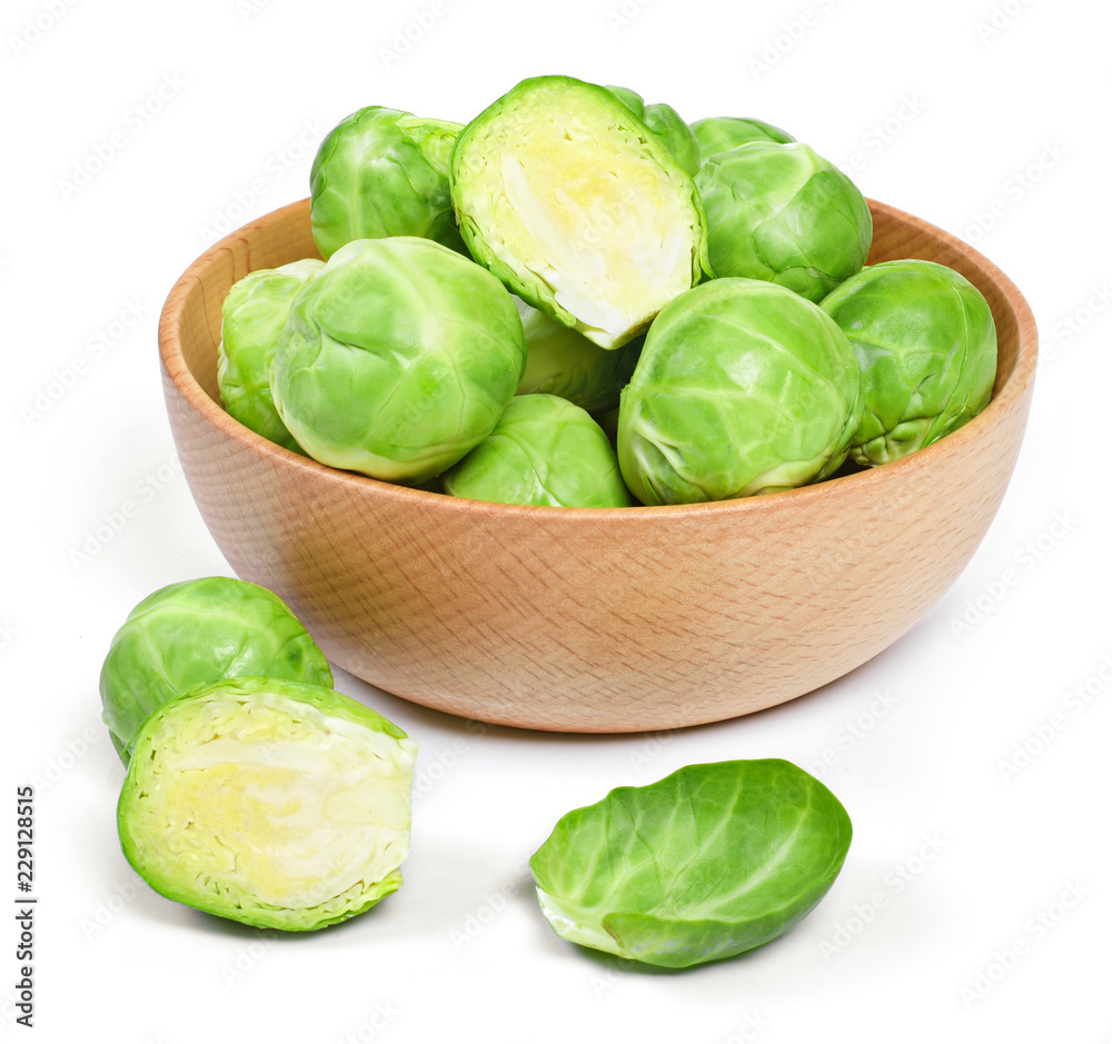 Delicious brussel sprouts in a wooden bowl. Brussel sprout, isolated on white background. Delicious brussel sprouts in a wooden bowl. Brussel sprout, isolated on white background.