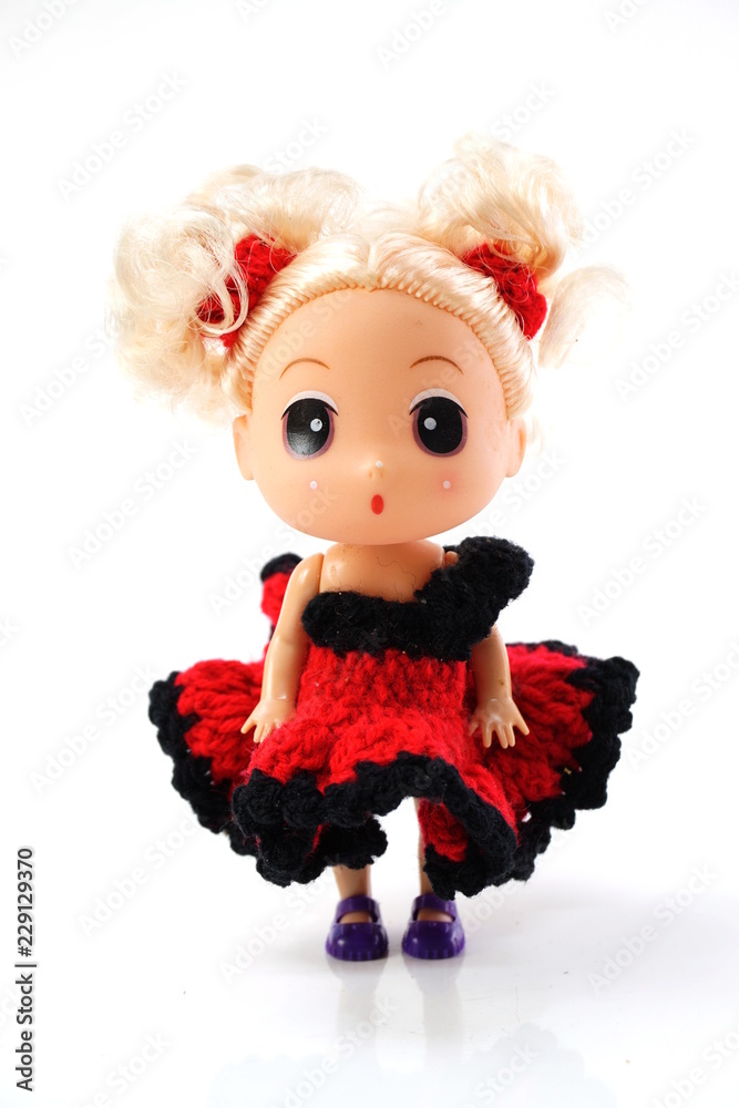 beautiful baby doll with red dress isolated on white background