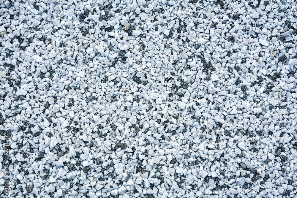 Small black and white pebble background. Top view texture Small black and white pebble background. Top view texture