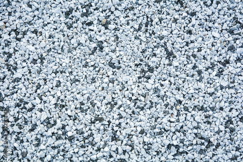 Small black and white pebble background. Top view texture