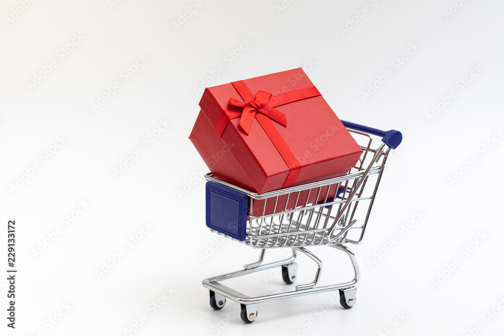 shopping cart present box with color ribbon on white background for christmas birthday special occasion