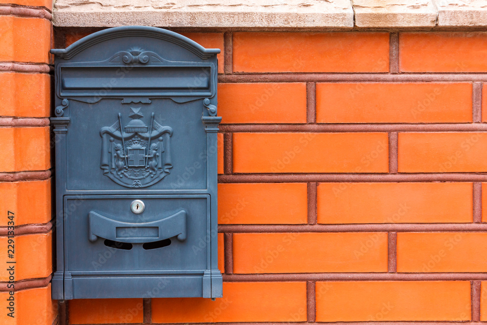 A beautiful mailbox hangs waiting for newspapers, parcels and letters. A beautiful mailbox hangs waiting for newspapers, parcels and letters.