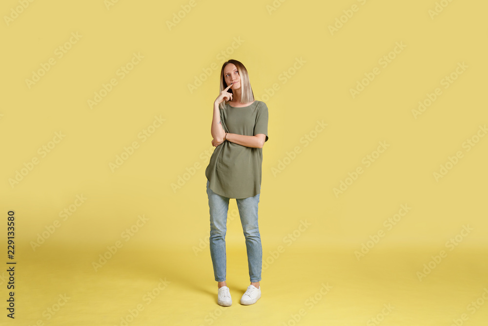 Blonde woman in casual wear in oversized t-shirt Blonde woman in casual wear in oversized t-shirt