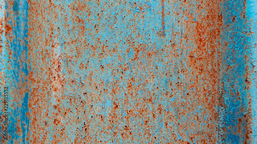 Rusty texture on a metal container that is on the street all year round.