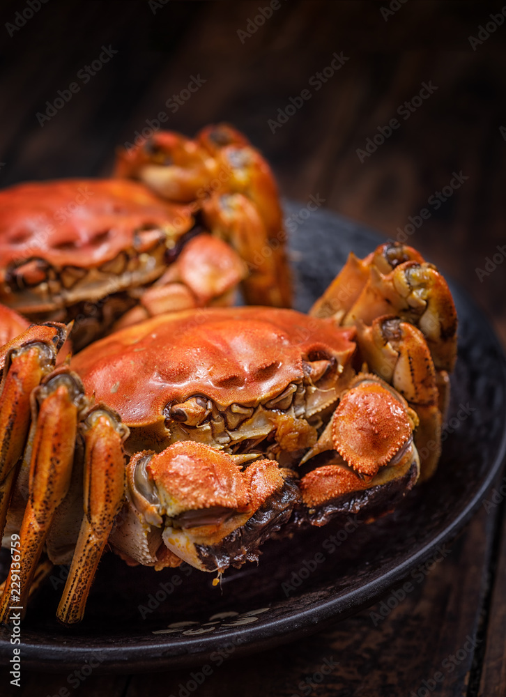 Two cooked hairy crabs on the table. Two cooked hairy crabs on the table.