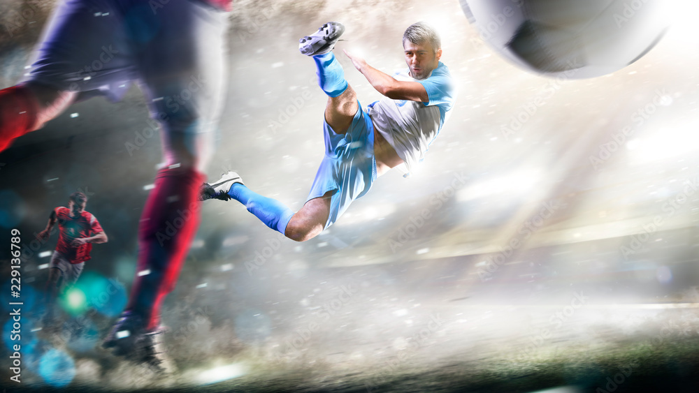 Soccer players in action on the grand stadium background panorama