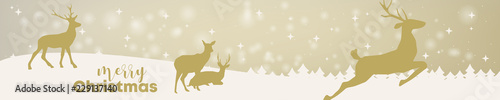 Banner mit weihnachtlicher Landschaft und Rentieren im goldenen Schimmer