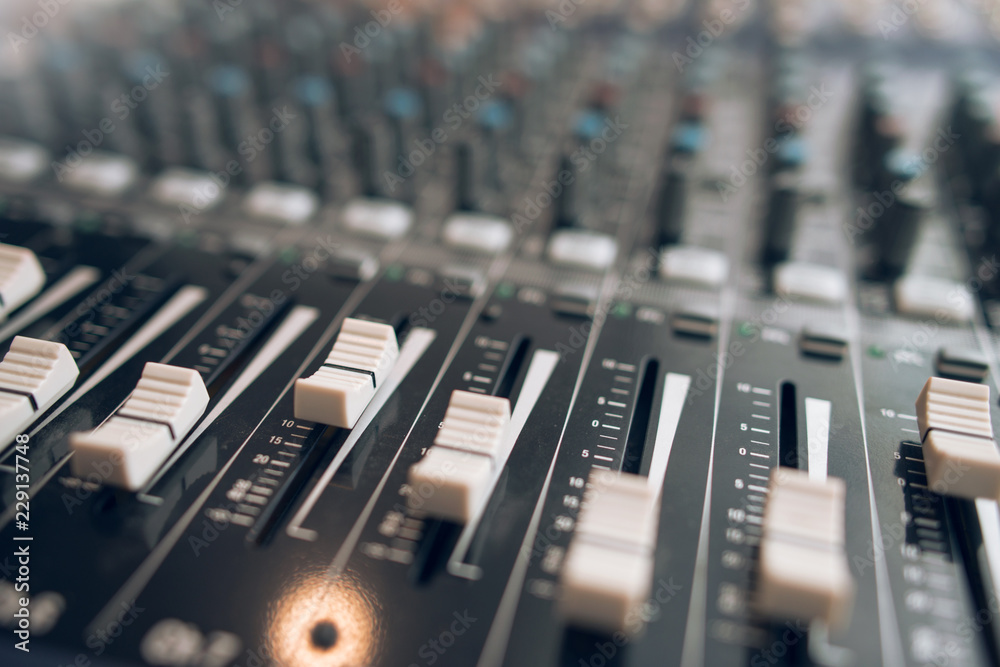 Audio equalizer close up. Studio audio volume mixer. Professional audio equipment. Audio equalizer close up. Studio audio volume mixer. Professional audio equipment.