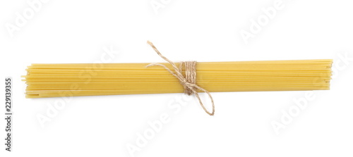 Spaghetti, yellow pasta isolated on white background, top view