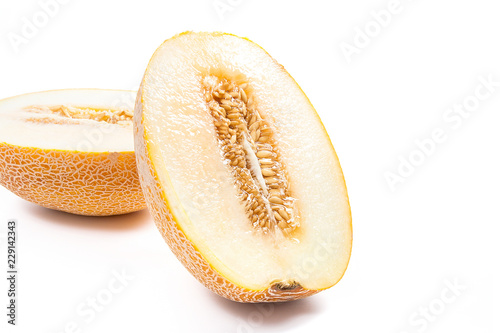 Half honeydew melon tropical fruit isolated on a white background.