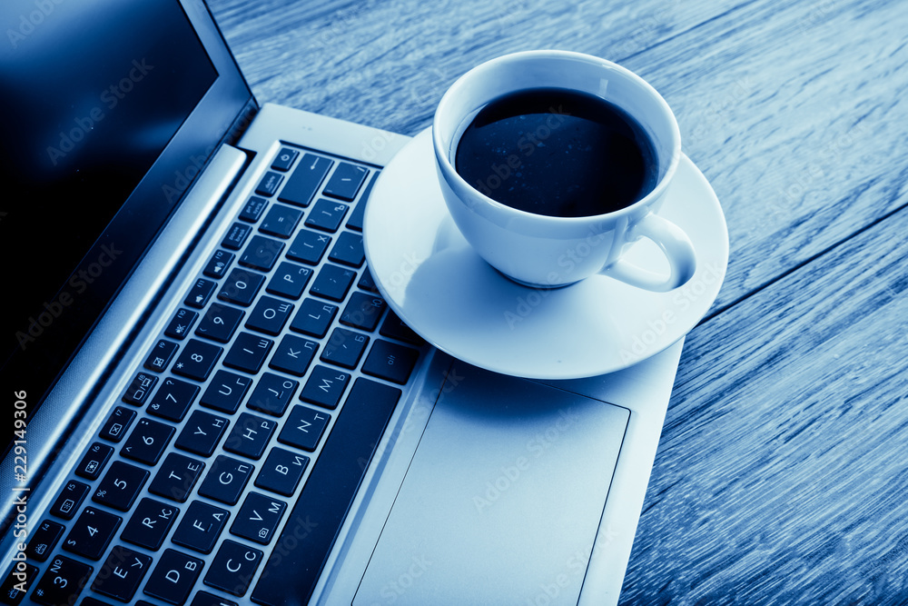 Cup of coffee and laptop Cup of coffee and laptop