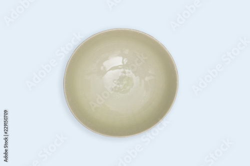 Top view-Empty green ceramic round dish plate isolated on white background.