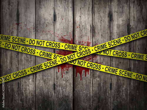 crime scene do not cross tape with bloody wall background. horror theme