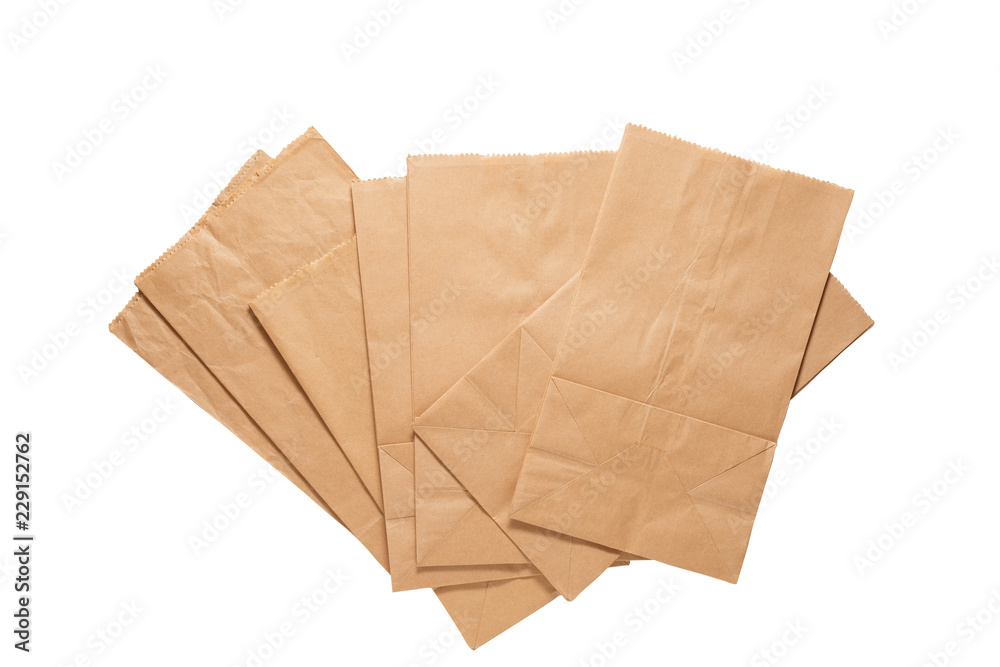 Brown paper bags with clipping path . Pile of new kraft paper bags