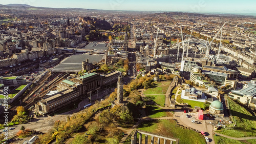 Aerial image over the monuments on Calton Hill in Edinburgh to the Castle on a bright Autumn day.