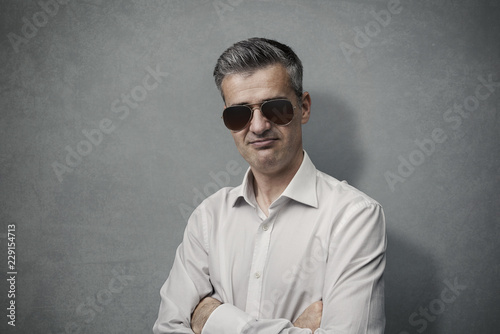 Cool man posing with sunglasses
