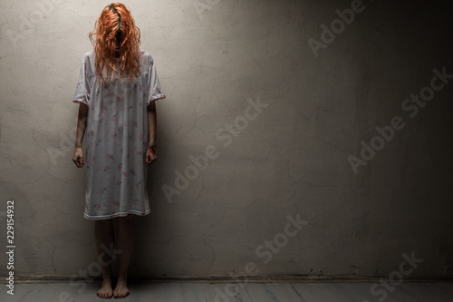 Quadro em tela Scary ghost woman in nightgown with knife / halloween, zombie concept